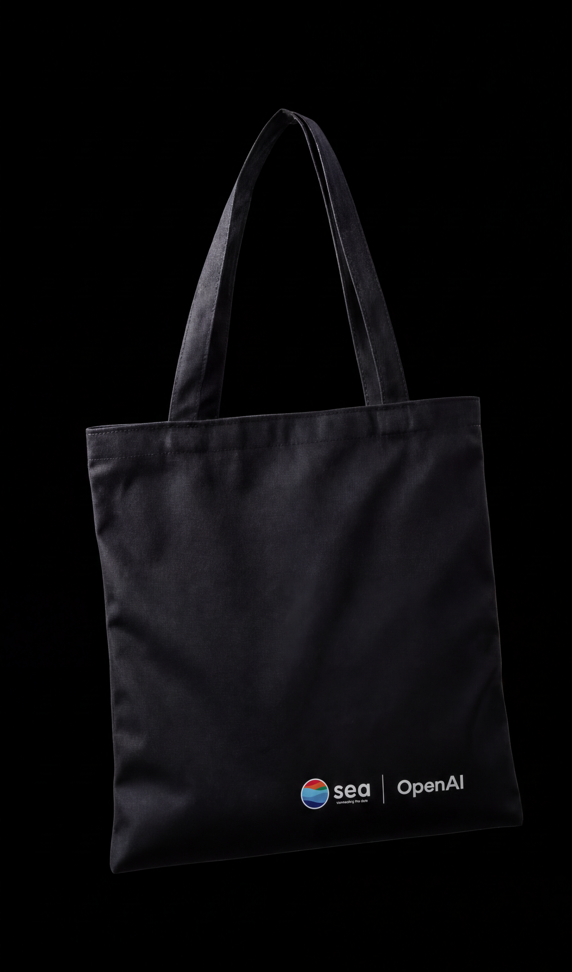 Black tote bag with the sea and OpenAI lockup